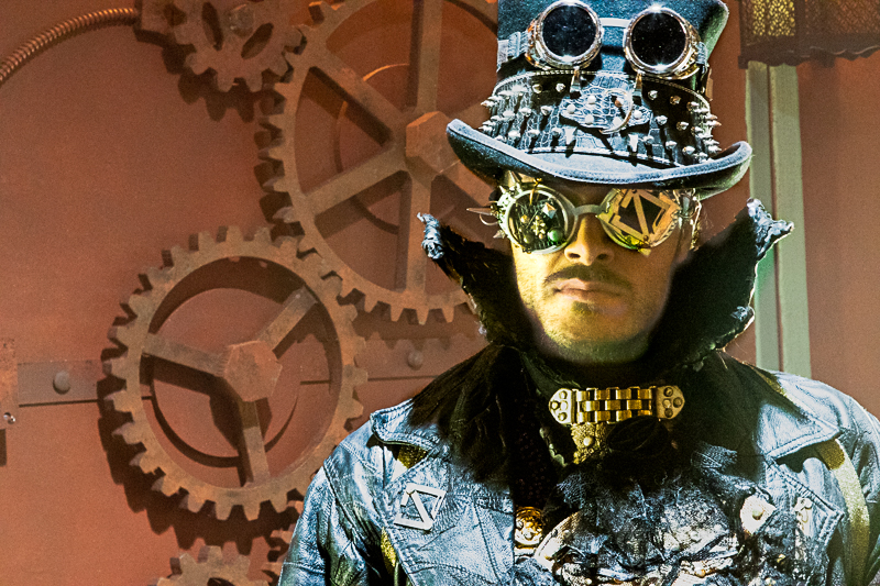 Close-up of steampunk costume — mechanical gear details and aged leather